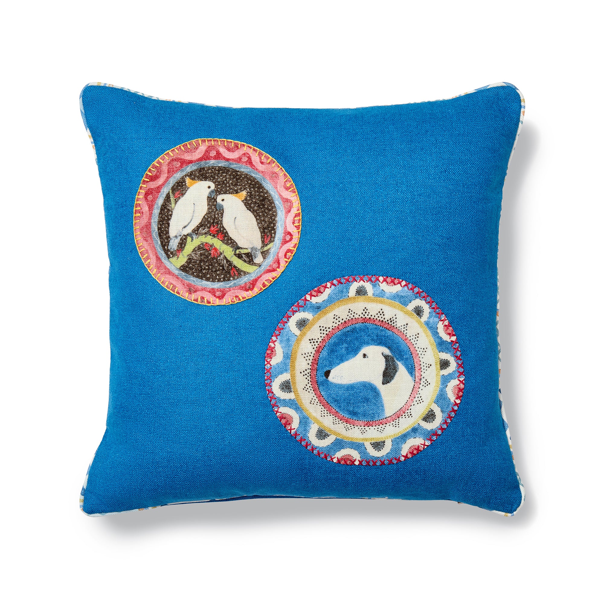 Hand-crafted Kit Kemp Design Studio cushion in bold blue linen, featuring two animal appliqués from Robina's Dinner Party with visible hand-stitched detailing. Bespoke character placement makes each piece unique.