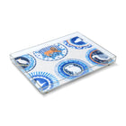 An exclusive Kit Kemp acrylic tray featuring the "Robina’s Dinner Party" illustration in vibrant blue. Designed for versatility, this practical and stackable piece serves as a stylish addition to a dining table or ottoman. Proudly made in the UK, it utilises high-quality materials to ensure durability while adding a playful, designer character to any interior setting.