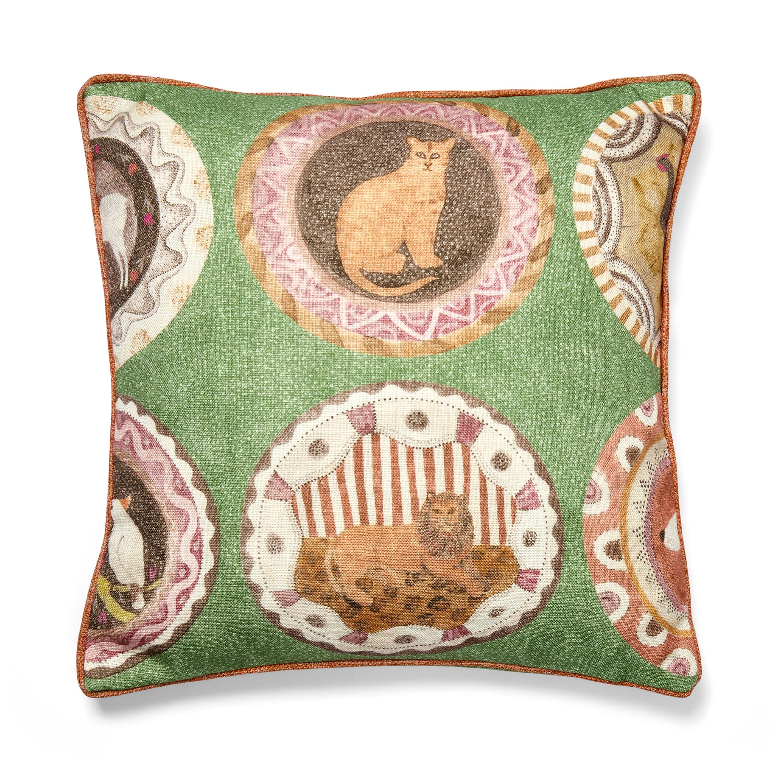 Decorative pillow with cat-themed embroidery on a green background