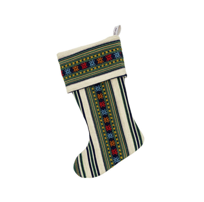 Romany Weave in Green and Blue Christmas stocking features intricate woven patterns in bold festive colours of blue, green, and orange, ideal for unique holiday gifting and elevating seasonal home decor.