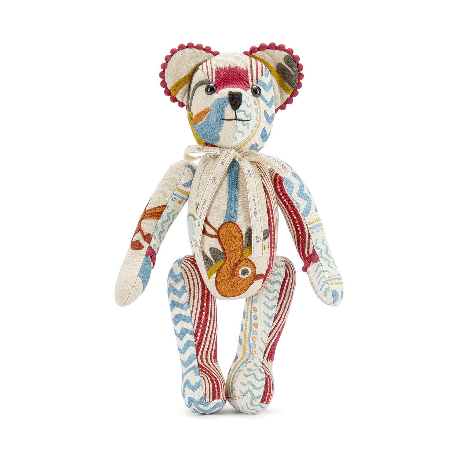 One-of-a-kind Ruby Anniversary Willow Bear, handmade in the UK. This collectible character features a numbered stamp on its foot and a signature "By Kit Kemp" cream ribbon, emphasising its exclusive, limited-edition nature and artisanal quality.