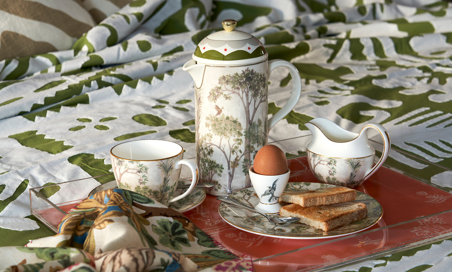 Shop Kit Kemp breakfast tray with tea pot, plates, cups and saucer, and egg cup for dining and table setting.