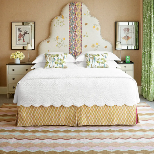 Firmdale hotel bedroom design including Safety Net Handwoven Wool Rug with warm earth and blush pink tones.