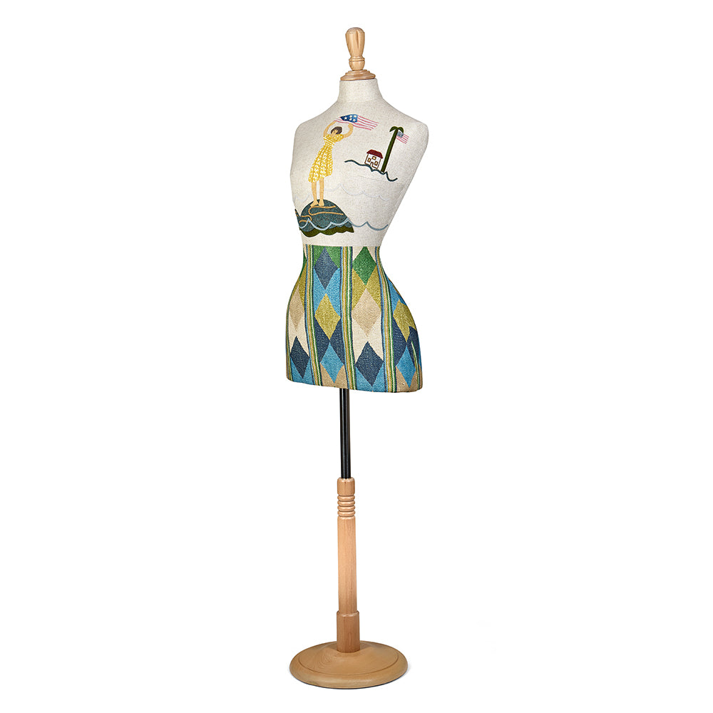 The Kit Kemp limited edition mannequin created as part of 250th USA Anniversary collection, featuring the geometric Compass fabric by Kit Kemp for GP & J Baker, showcased in a vibrant harlequin pattern.
