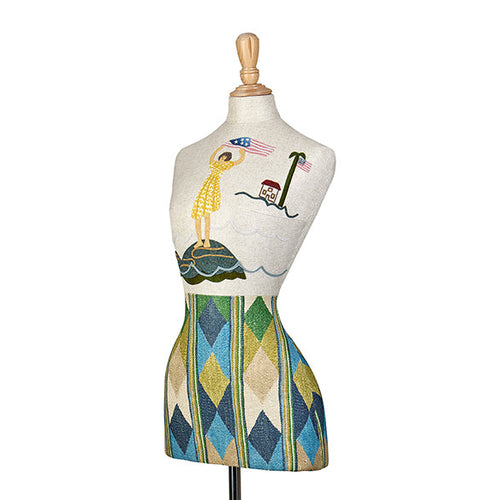The Kit Kemp limited edition mannequin created as part of 250th USA Anniversary collection, featuring the geometric Compass fabric by Kit Kemp for GP & J Baker, showcased in a vibrant harlequin pattern.