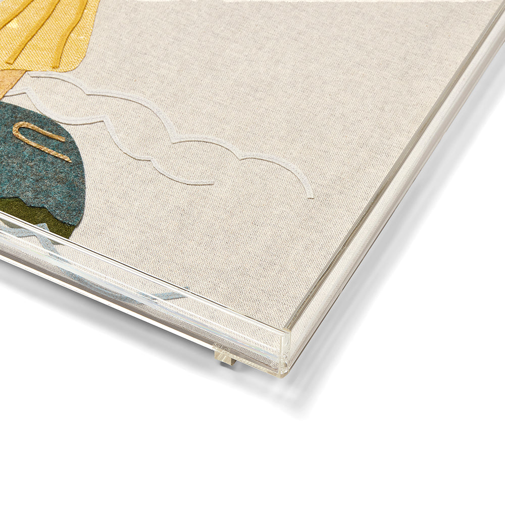 A close-up of a Kit Kemp acrylic tray showing the intricate hand-stitched details of a lady waving an American flag, set within a clear, high-quality stackable frame.