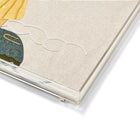 A close-up of a Kit Kemp acrylic tray showing the intricate hand-stitched details of a lady waving an American flag, set within a clear, high-quality stackable frame.