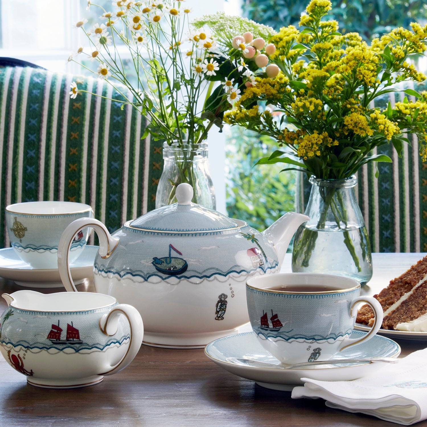 High tea set with Sailor's Farewell fine china tea cups and saucers, tea pot, milk jug, and plenty of design joy created by Kit Kemp.
