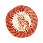 A hand-painted decorative ceramic plate by Sasha Compton titled "My Marmalade Cat - Love Well Earnt," featuring a central illustration of a seated tabby cat in terracotta tones, encircled by a white-dotted border and wide, expressive brushstrokes in deep clay-red.