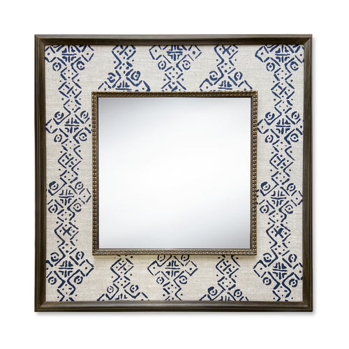 The Mali Mirror, features Kit Kemps Mali fabric designed for Blithfield, in natural linen, with a geometric indigo print, forming broad stripes simplified diamond, and crosses, stretched to form a wide decorative border around a square central mirror, in a wooden frame, and is a great statement mirror for any cloakroom, or hall.