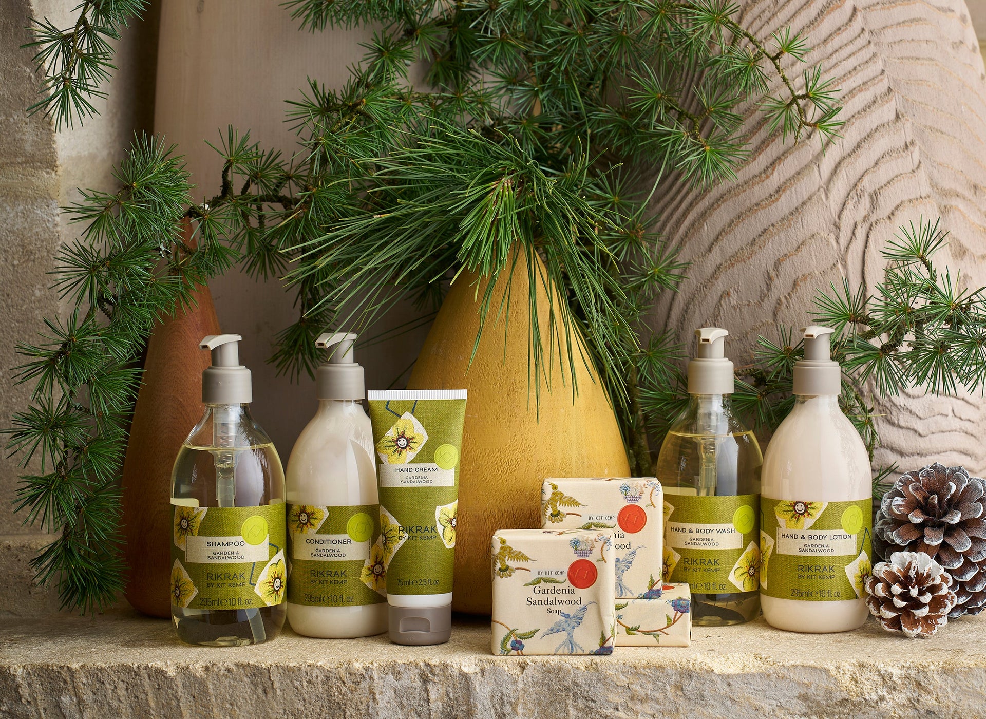 Gardenia and Sandalwood body and bath collection by Shop Kit Kemp, including shampoos, conditioners, body and hand washes and lotions, soaps, and room scents.