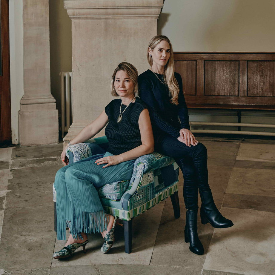 Minnie Kemp and Willow Kemp with the Collector's Chair created in collaboration with Christopher Farr