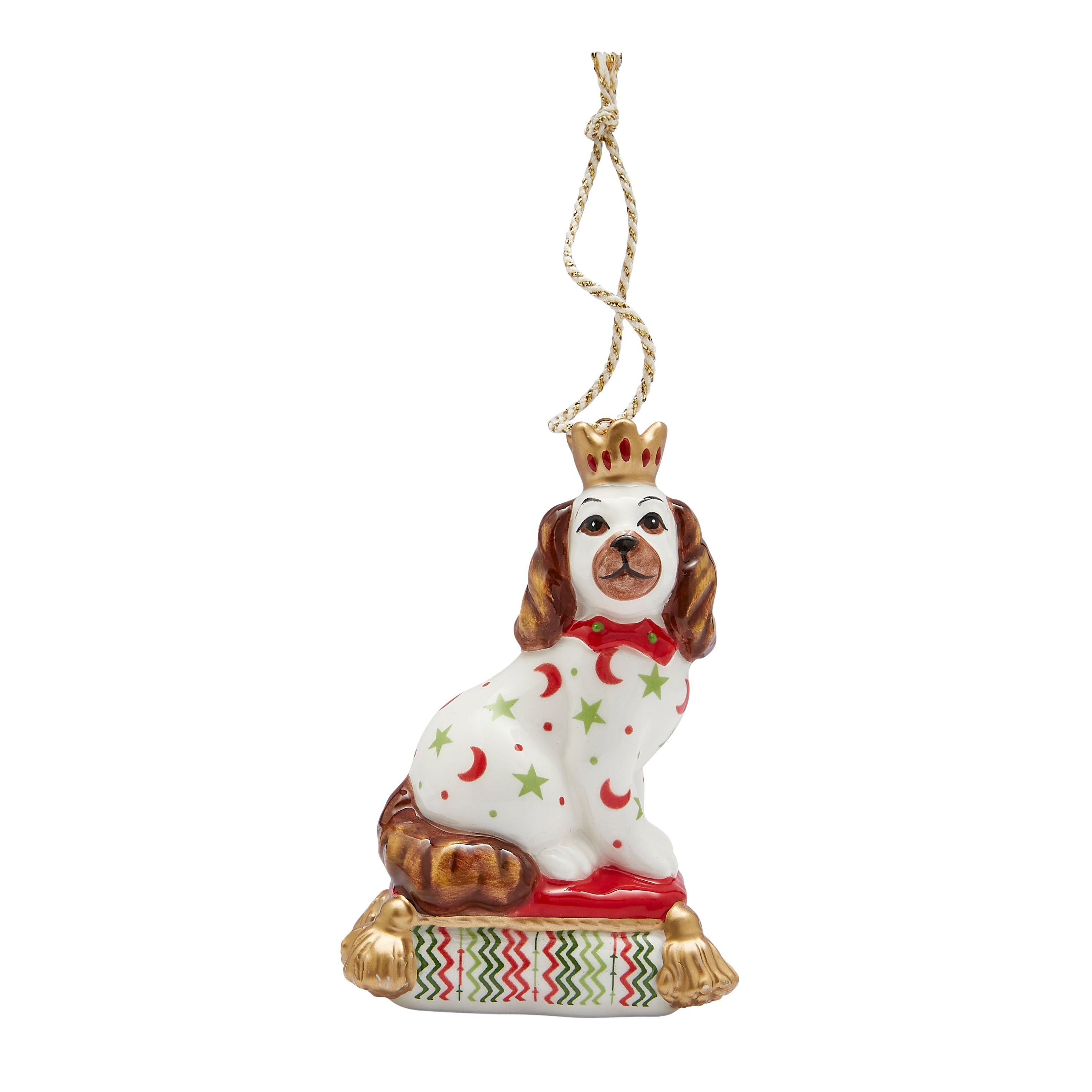 Festive fine china Christmas tree decoration in the shape of a sitting Staffordshire Dog. Inspired by Kit's patchwork animals, this stylish ornament features bright patterns (red crescent moons, green stars) and gold accents, making it a unique and delightful addition to any Christmas tree or a perfect gift for a dog lover.