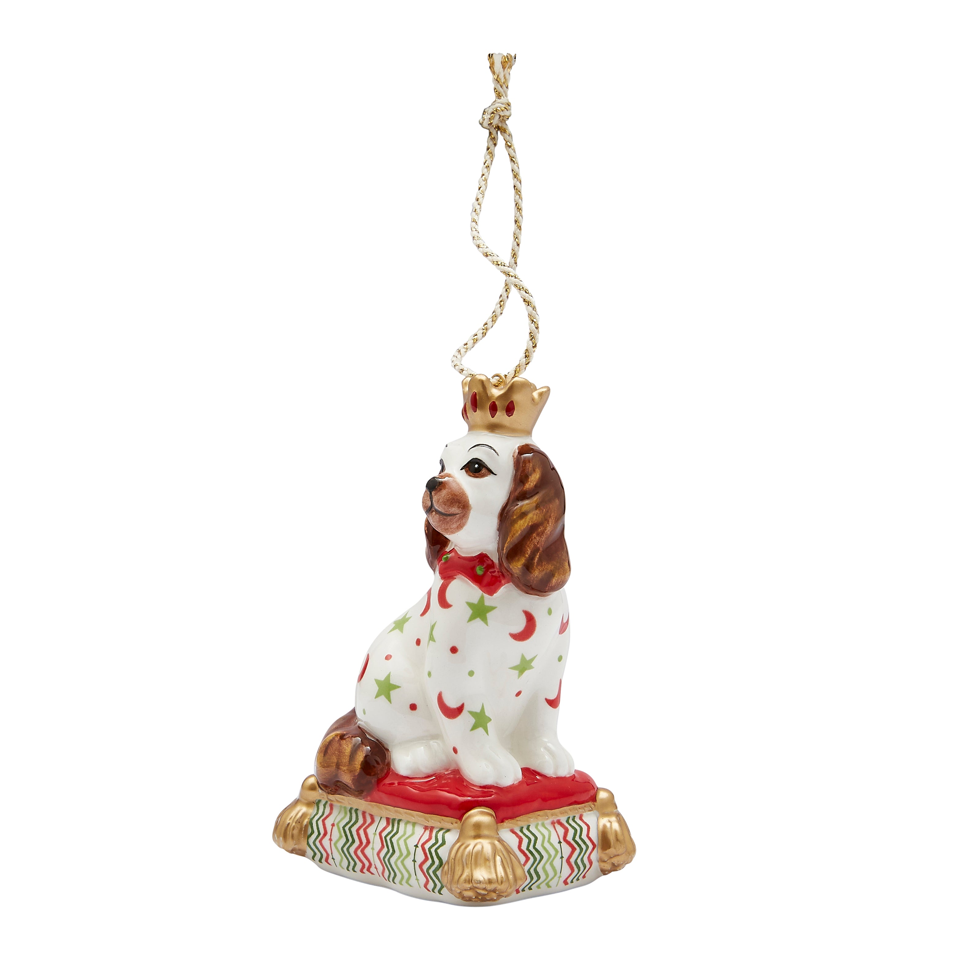 Festive fine china Christmas tree decoration in the shape of a sitting Staffordshire Dog. Inspired by Kit's patchwork animals, this stylish ornament features bright patterns (red crescent moons, green stars) and gold accents, making it a unique and delightful addition to any Christmas tree or a perfect gift for a dog lover.
