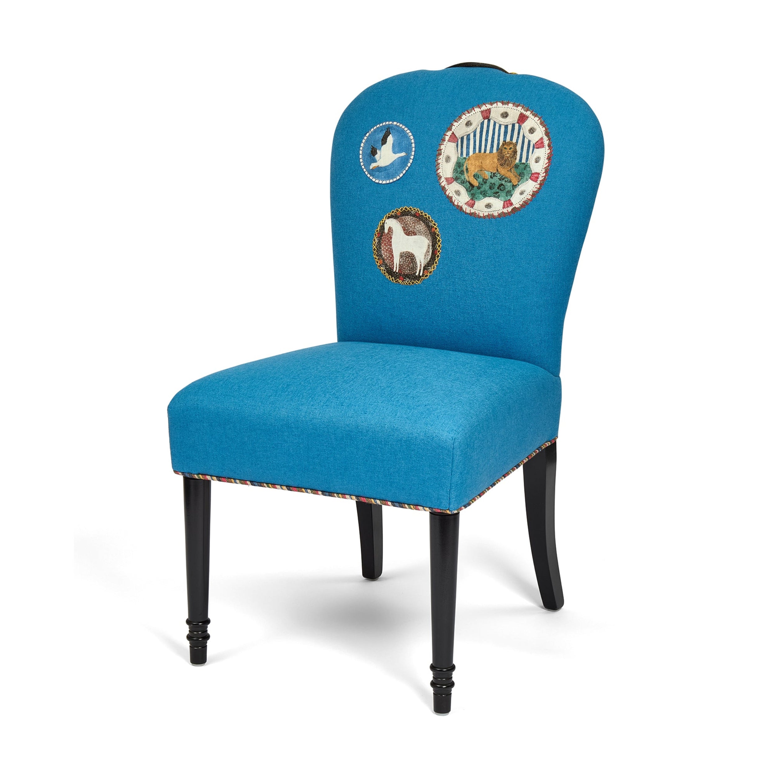 Blue chair with embroidered designs on a white background