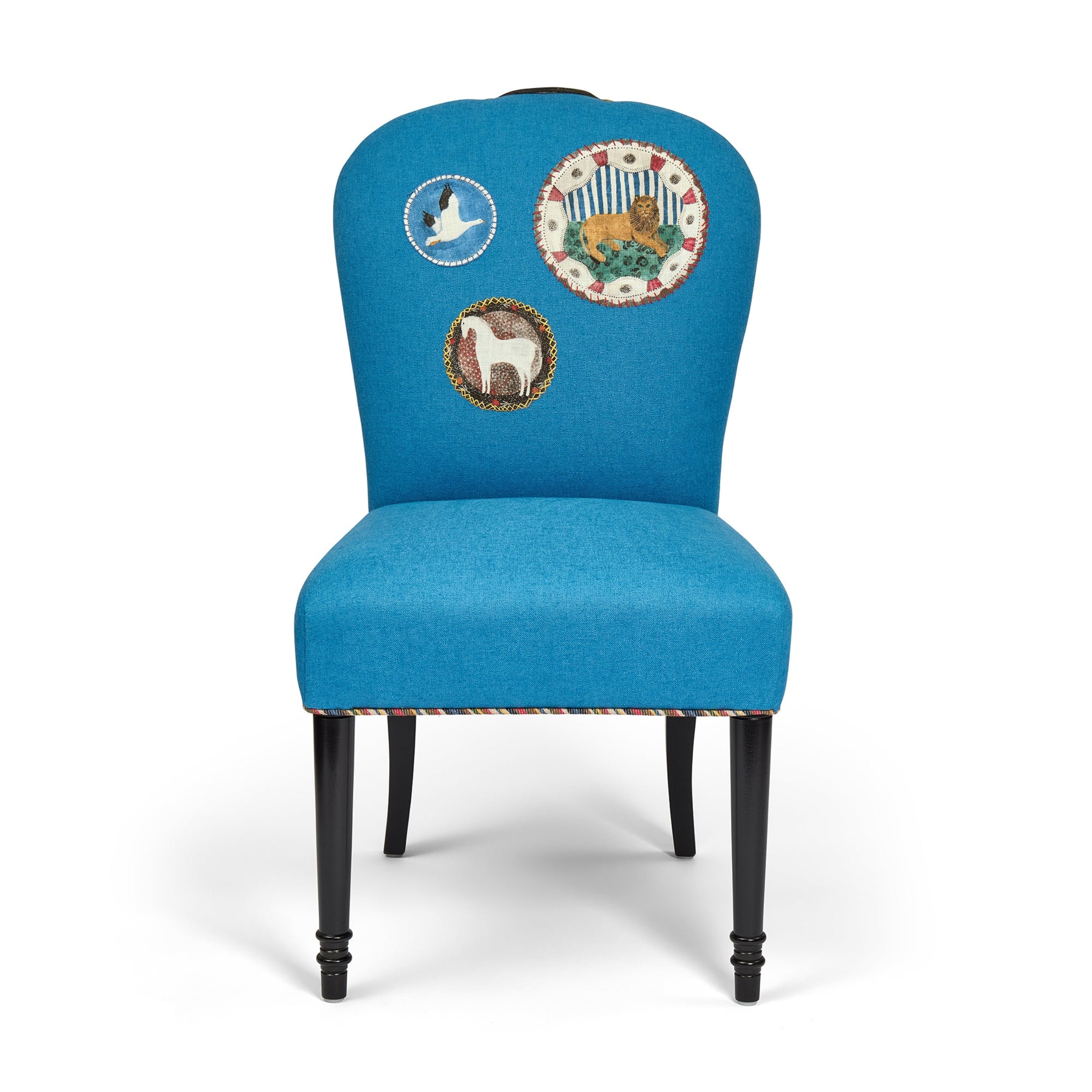 Blue chair with embroidered designs on a white background