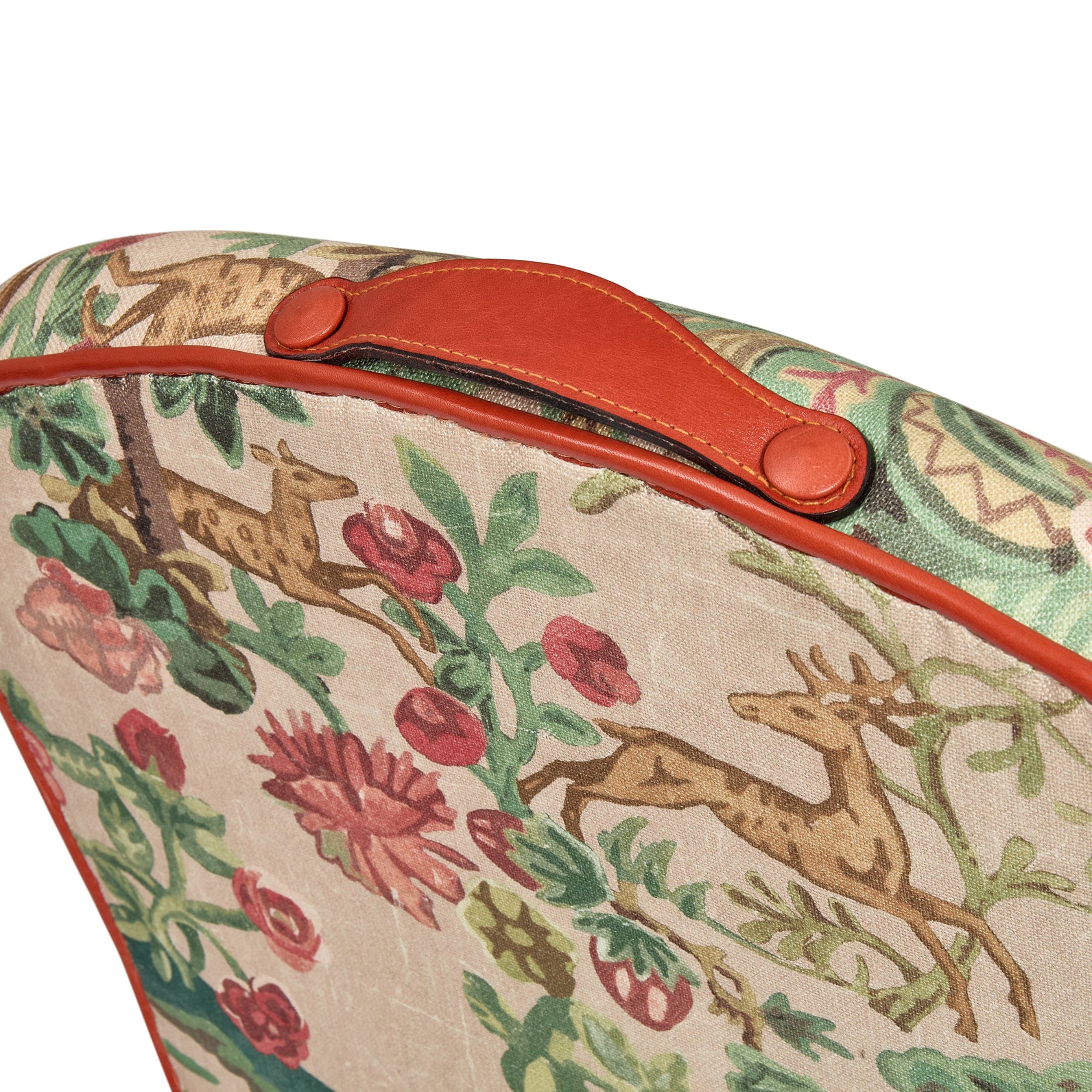 Decorative suitcase with deer and floral pattern on a beige background