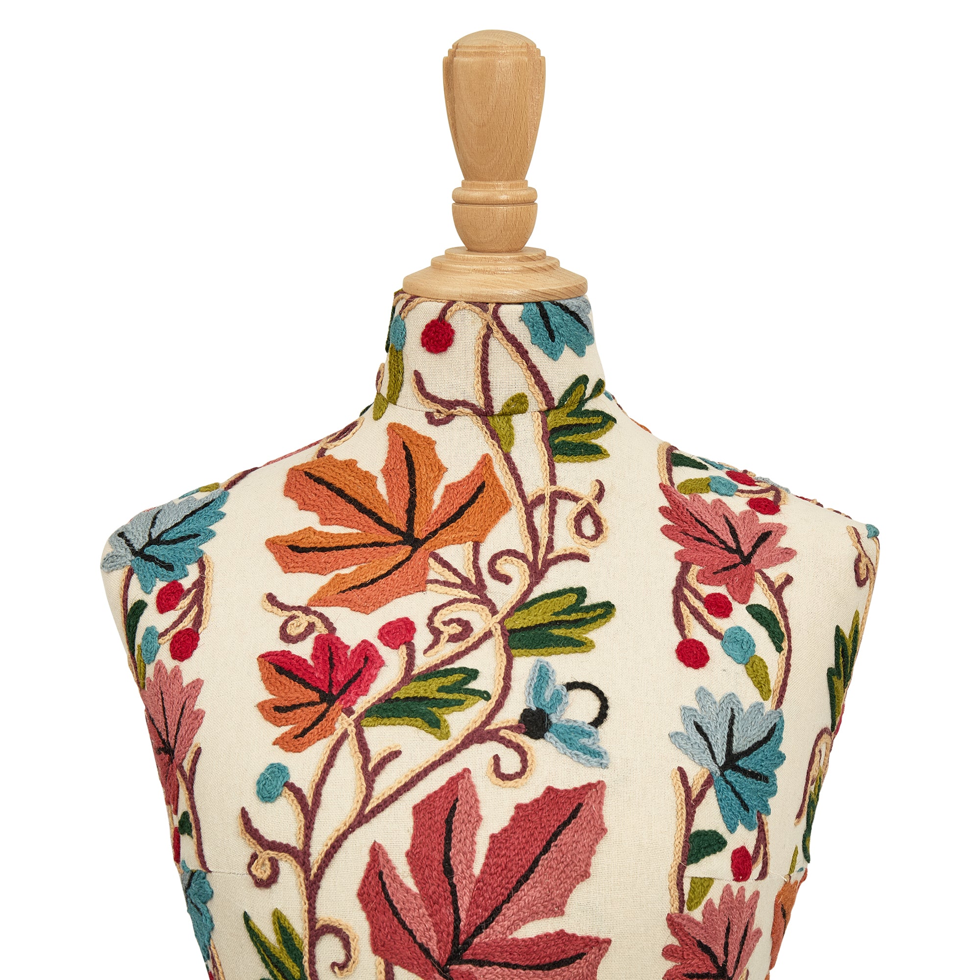 Decorative mannequin bust with floral embroidery on a white background