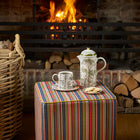Tight Rope fabric striped ottoman with a Tall Trees cafetiere and mug is a cosy winter ritual setting.