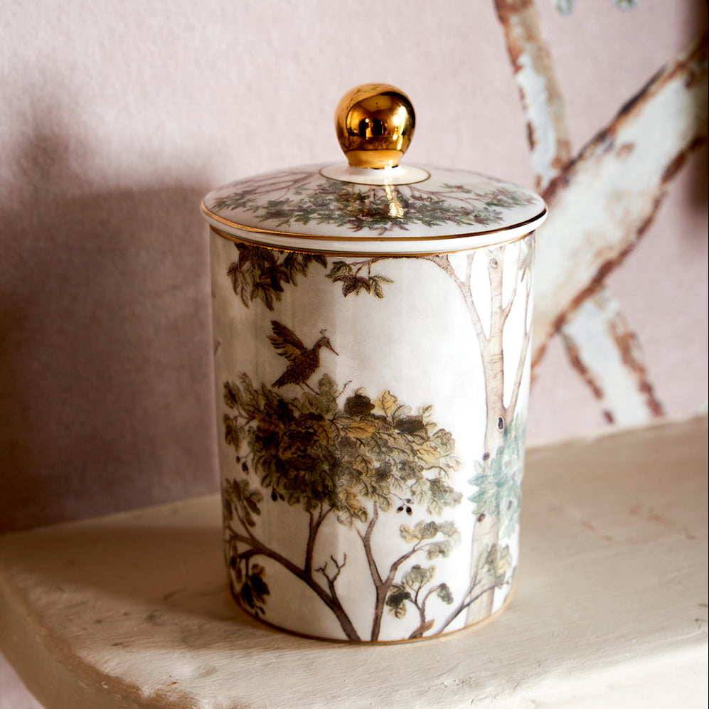 Add a touch of artistic design to home decor, with Kit Kemp's Tall Trees ceramic candle vessel, complete with gold detail lid.