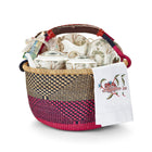 Tea for Two colourful woven basket with a leather handle containing the Tall Trees fine bone china tea set including a small teapot, two teacups and saucers, tea caddy tin with 20 tea bags, and a decorative Mythical Creatures napkin