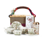 Luxurious Tea Set featuring Kit Kemp's signature Tall Trees fine bone china collection, including a small teapot, two teacups and saucers, tea caddy tin with 20 tea bags, and a decorative Mythical Creatures napkin.