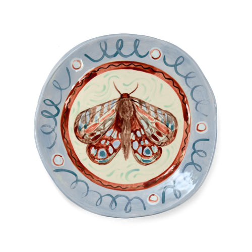 Sasha Compton plate titled The Garden Moth Small But Mighty is exclusive artwork for Shop Kit Kemp, handmade and glazed with 24 carat gold details around the edges