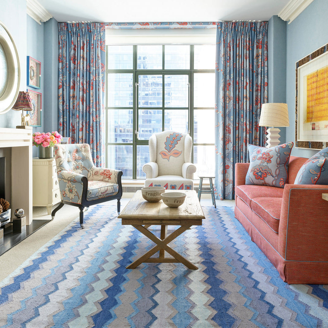 Soft underfoot texture with a medium 0.25" pile height, and handcrafted in India, the blue tones in the Safety Net rug ground this blue and red tones living space in the Whitby hotel suite. Perfect to pair with Chainstitch fabric and furniture upholstery in Linen range by Kit Kemp. 