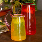 Hand-blown glass jugs for serving drinks, displaying fresh flowers or simply adding a playful pop of colour to any table and home setting.