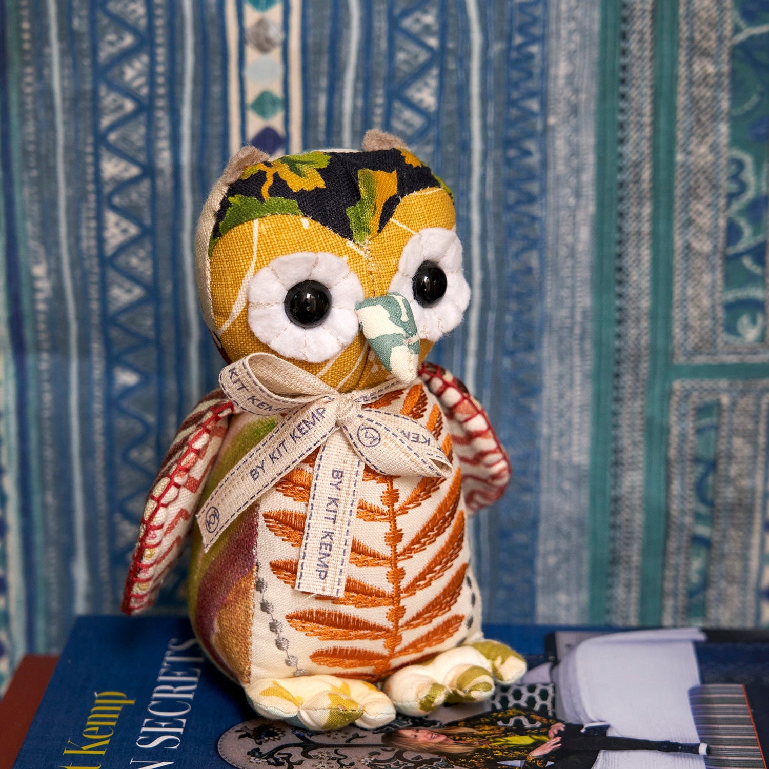 One-of-a-kind luxury decorative owl made from repurposed high-end interior fabrics; a colourful, eco-friendly accessory handcrafted in the UK, perfect for designer-led home styling.