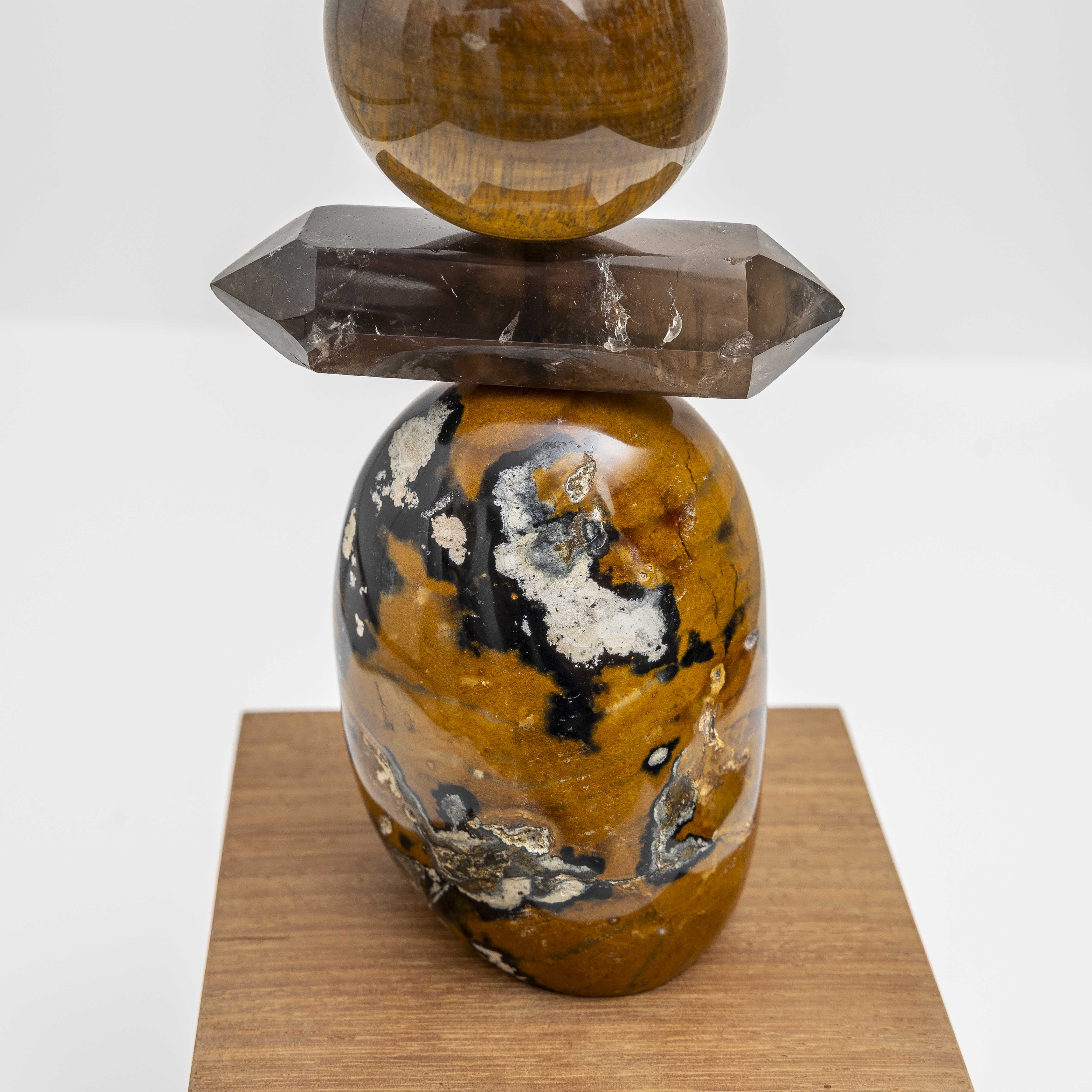 Ancient Sands II is entirely unique and made from the following precious crystal stones: From the top – 2 pieces of Yellow Jasper, Tigers Eye, Pietersite sphere, Yellow Jasper, Tigers Eye sphere, Smokey Quartz rod and a large form of Yellow Jasper.  