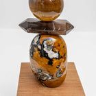 Ancient Sands II is entirely unique and made from the following precious crystal stones: From the top – 2 pieces of Yellow Jasper, Tigers Eye, Pietersite sphere, Yellow Jasper, Tigers Eye sphere, Smokey Quartz rod and a large form of Yellow Jasper.  