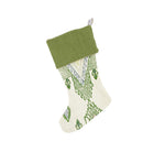 Artisan-style Christmas stocking featuring Kit Kemp's 'Travelling Light' weave. The intricate geometric design in shades of crisp green and blue on an ivory background offers a fresh, earthy take on festive decor. A luxurious and unique piece, perfect for sophisticated holiday gifting.