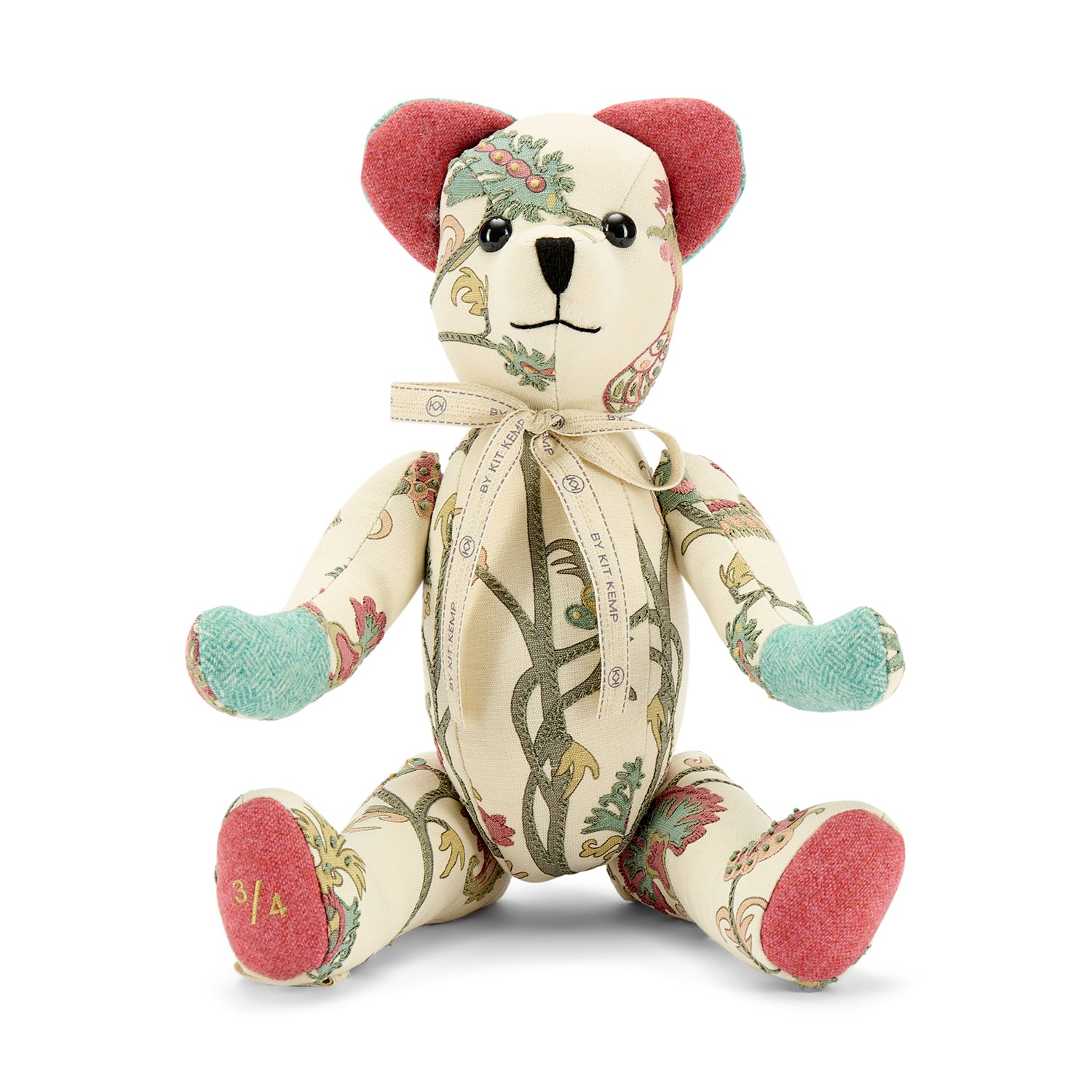 A luxury Willow Bear from the Kit Kemp collection, meticulously handcrafted from 100% linen in the signature Tree of Life fabric. The bear showcases a refined cream base with an intricate, climbing botanical pattern in soft sage green, pink, and ochre tones.