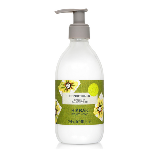 A 295ml plastic bottle of conditioner with pump dispenser scented with Gardenia Sandalwood. Label has a green friendly flowers design applied.