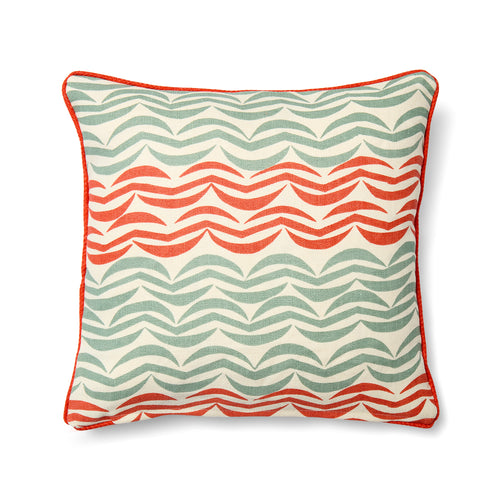 Design Studio cushion featuring a bold, woven pattern of orange and grey waves arranged in a subtly irregular striped formation. The textured fabric is framed by a vibrant, contrasting tangerine piped edge, highlighting the rhythmic and graphic nature of the design.