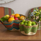 Two unique hand woven baskets for displaying fruit and essentials, perfect for table settings and larders.