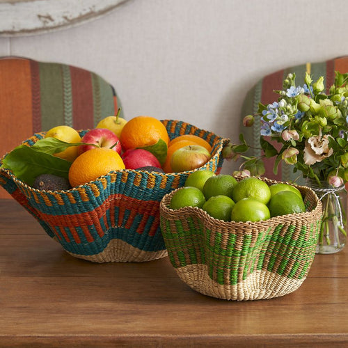 Two unique hand woven baskets for displaying fruit and essentials, perfect for table settings and larders.