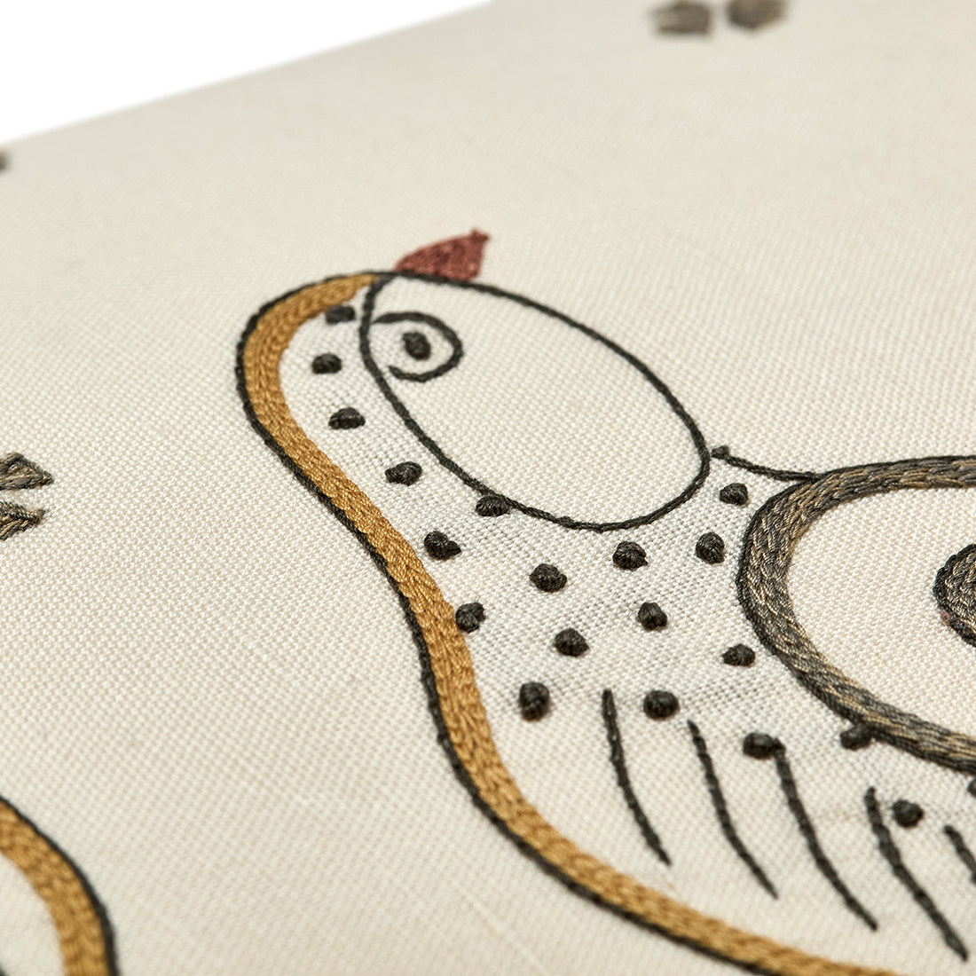 Close-up of the intricate hand-stitched birds, highlighting the fine needlework and tactile textures of the artisan embroidery.