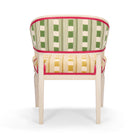 Two tone, green and golden yellow, versions of Lost and Found fabrics, used on seat and reverse part of Whitby chair, offset with contrasting pink leather piping. 