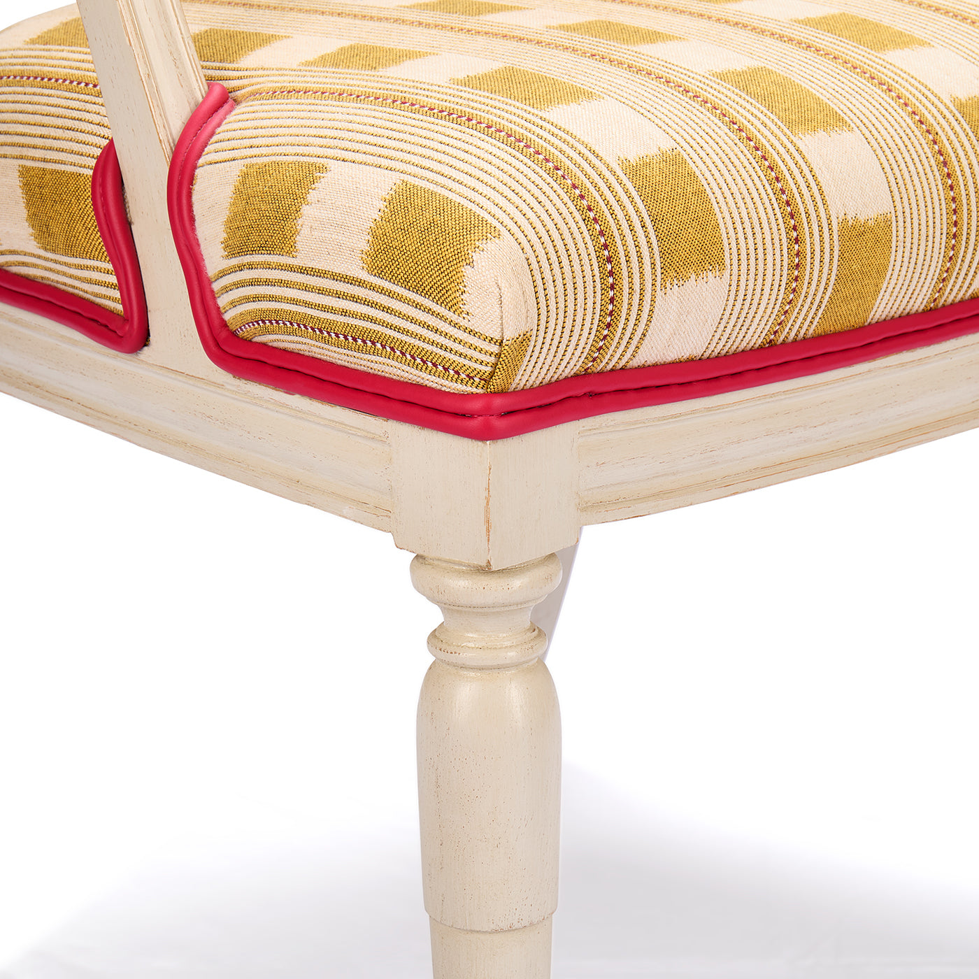 Close up on Whitby chair edge, with two layers of pink leather piping around the front and back of the chair. 