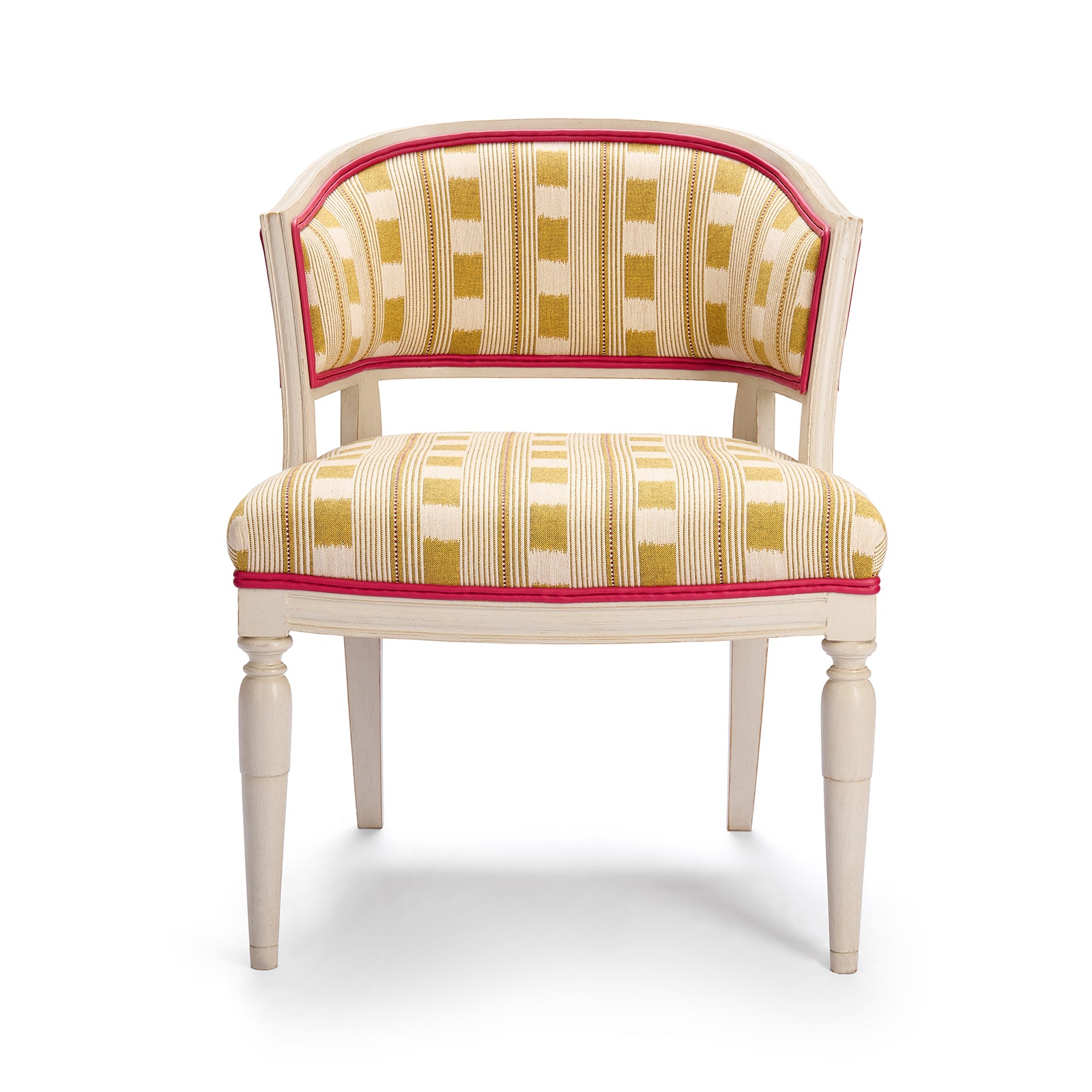 Whitby Chair in Lost and Found lemon fabric, showing hand carved solid wood legs in off white with a double pink leather trim piping.