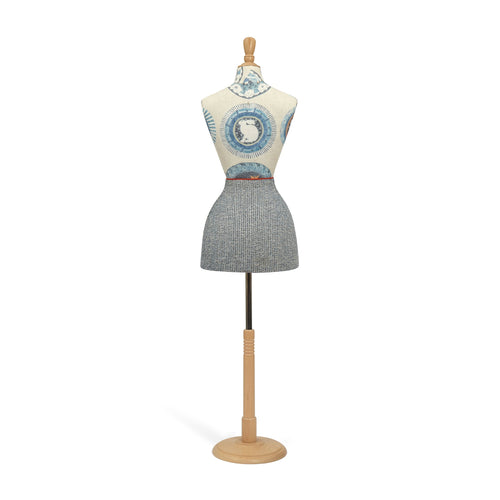 Mannequin wearing a patterned dress on a white background