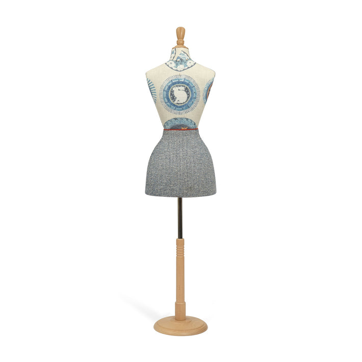 Mannequin wearing a patterned dress on a white background