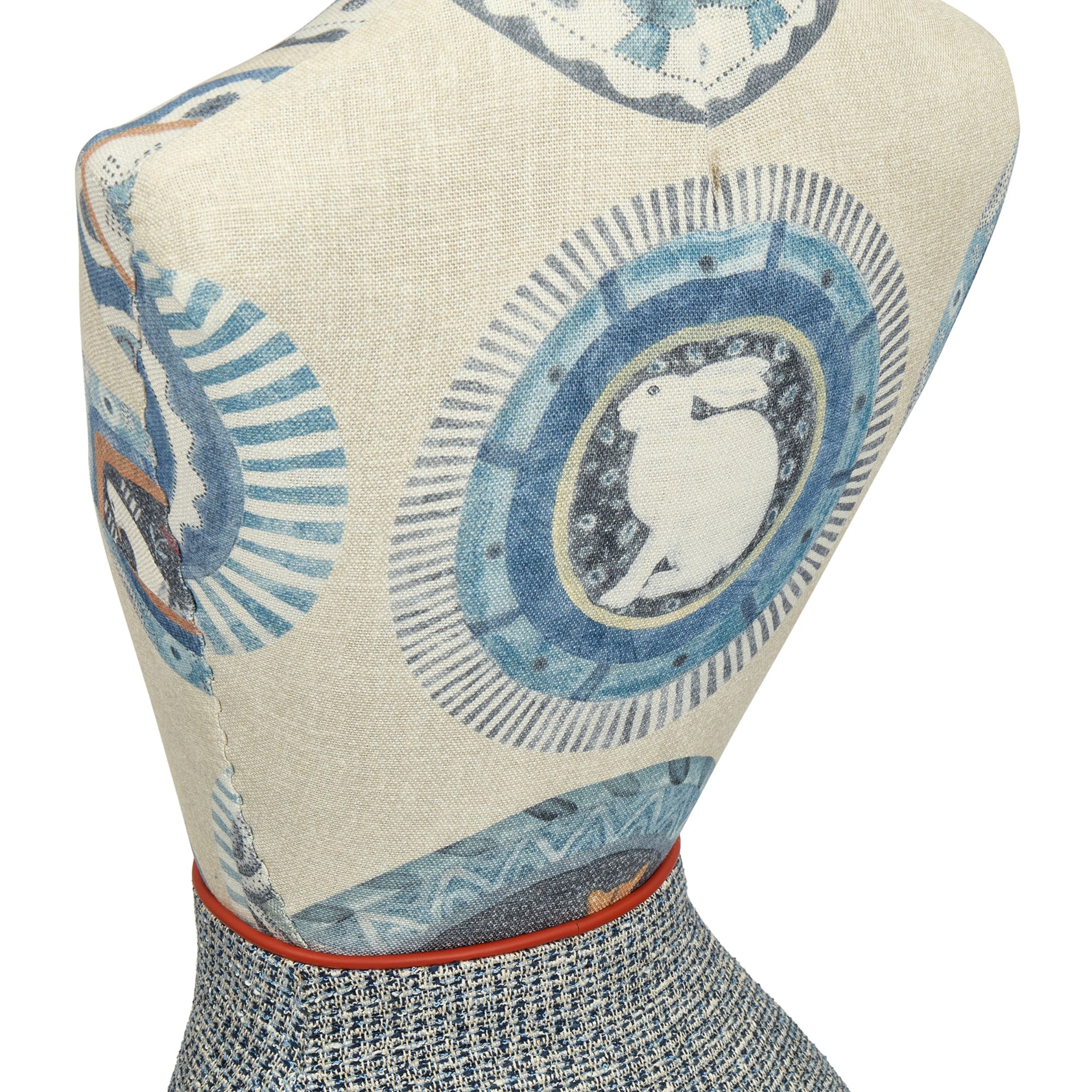 Mannequin torso with decorative fabric featuring blue and white patterns on a white background