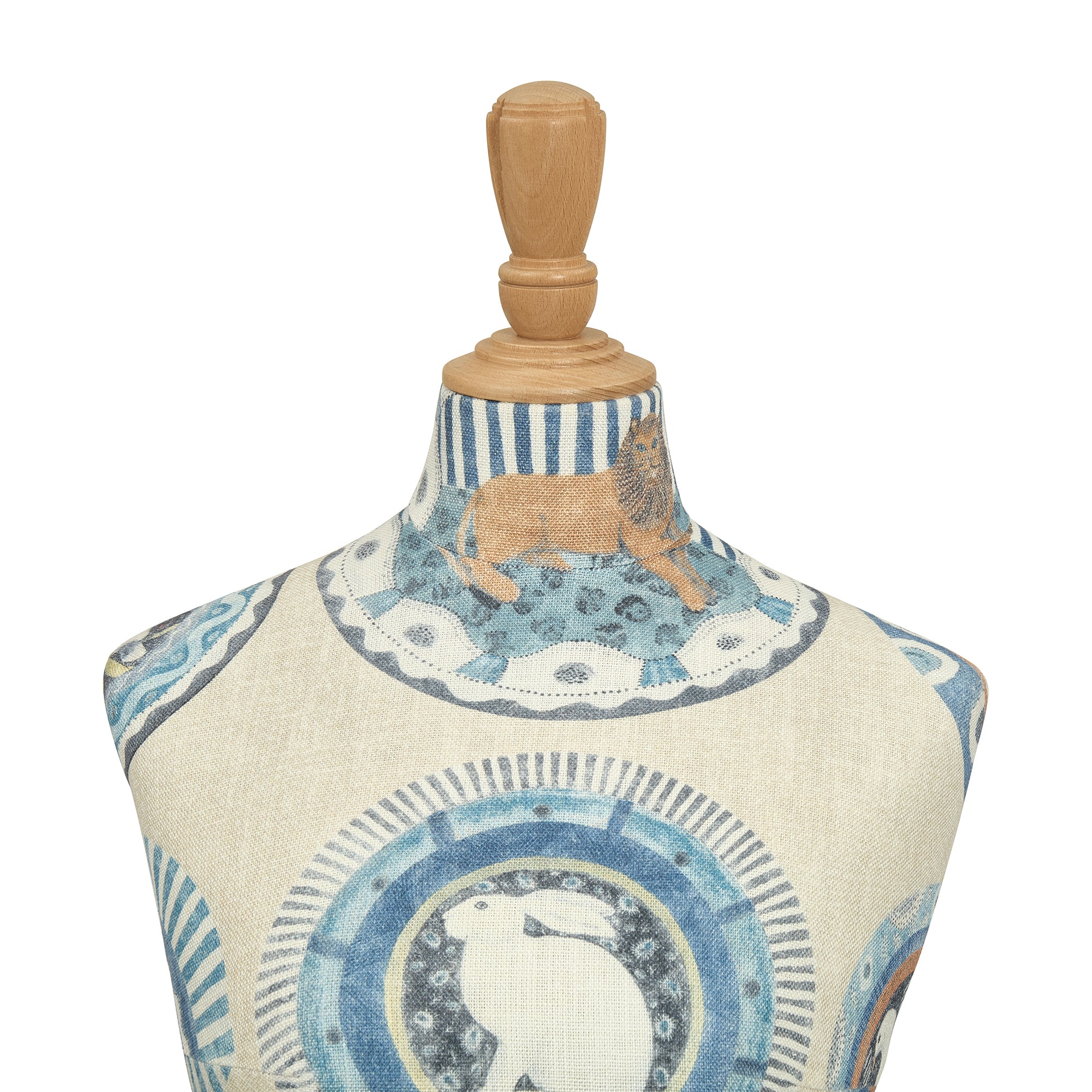 Mannequin torso with decorative fabric and wooden base on a white background