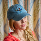 Willow Kemp wearing a blue Doodles baseball cap 