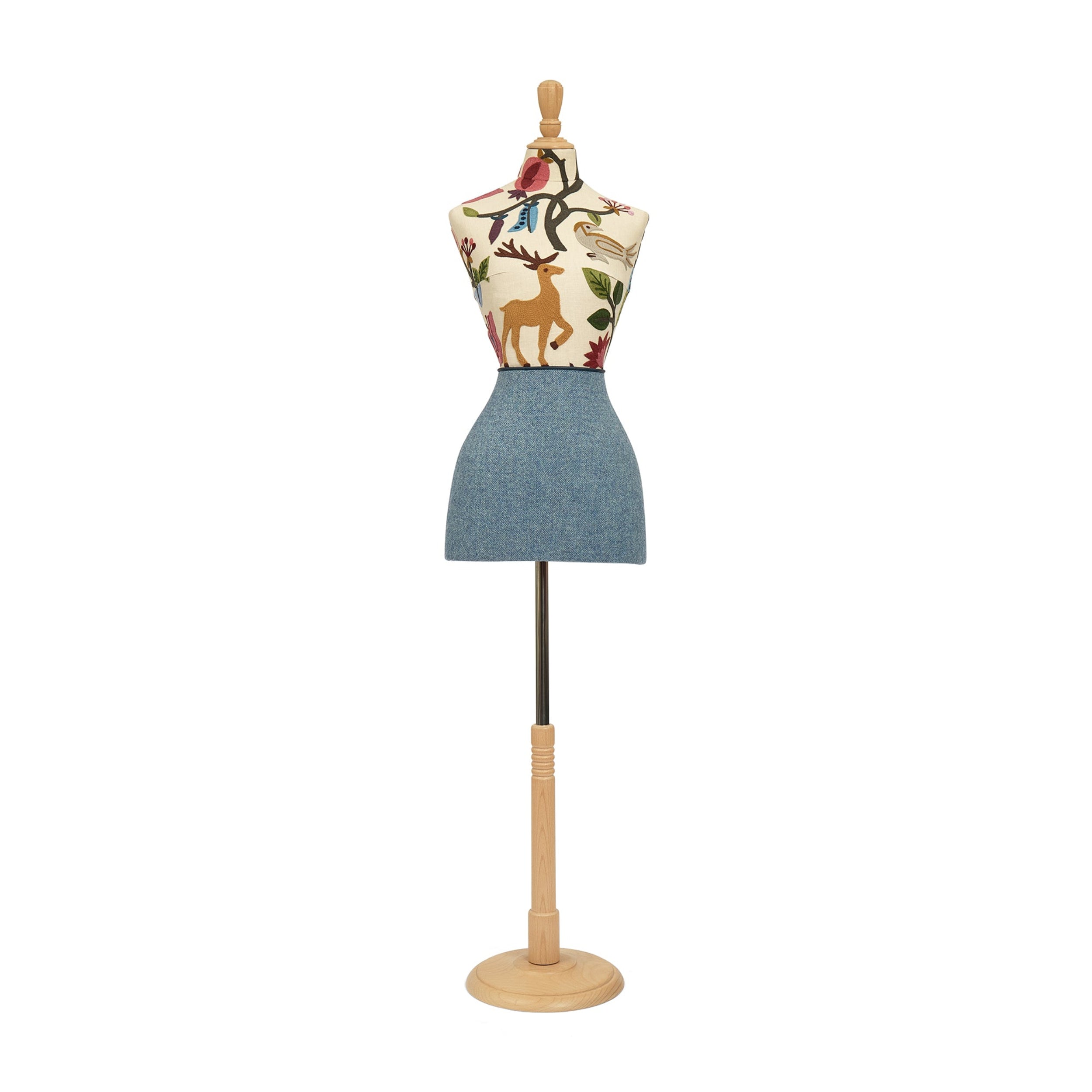Mannequin torso with floral pattern and denim skirt on a white background