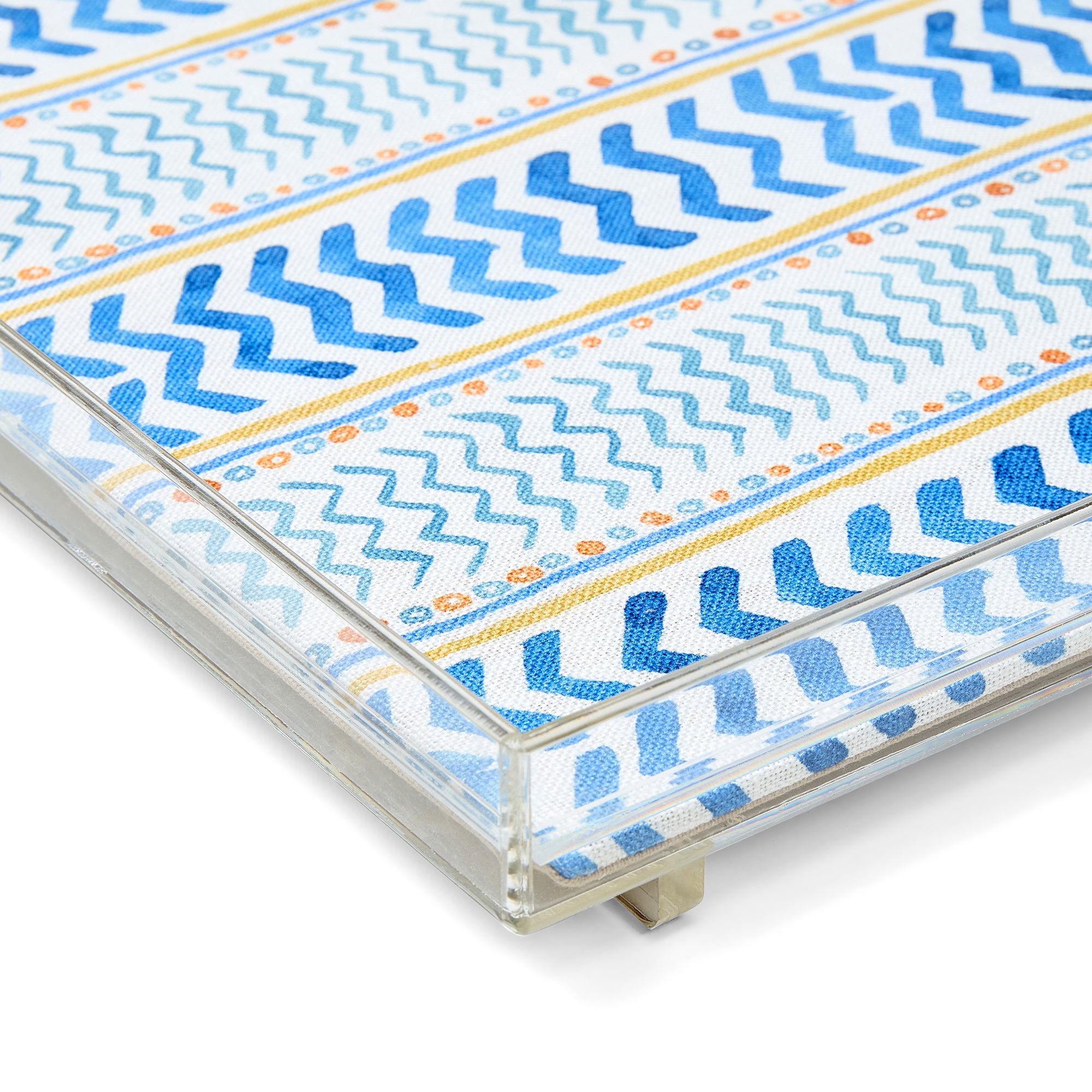 Artisan-designed acrylic tray by Kit Kemp featuring a sustainable fabric panel in the blue "Wriggle Room" pattern. This stylish, stackable tray uses a small-scale geometric stripe design with painterly horizontal lines to create depth and movement, perfect for adding texture to any home surface.