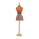 Mannequin wearing an orange apron with blue floral patterns on a white background